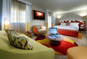 a living room filled with furniture and a laptop at Hard Rock Hotel Marbella - Adults Only Recommended in Marbella
