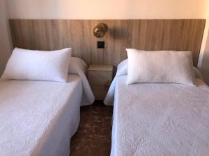 A bed or beds in a room at APARTAMENTO KORINTO