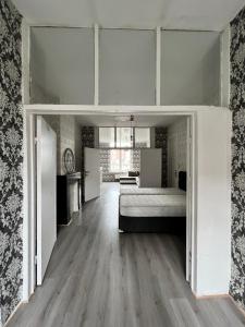 a bedroom with a bed in a room at Proche de tout lieux touristiques à Liège in Liège