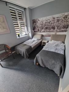 Postel nebo postele na pokoji v ubytování Apartamenty Duo
