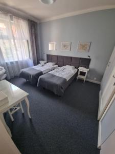 Postel nebo postele na pokoji v ubytování Apartamenty Duo
