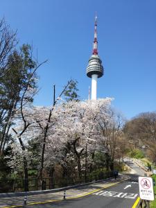 a street with the eiffel tower in the background at Newly renovated hidden gem in Seoul