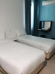 Postelja oz. postelje v sobi nastanitve YY48 Hotel 2 Mins Walk From Masjid Jamek LRT Station