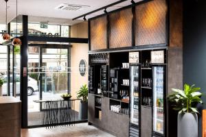 a store front with a shelf of products at Three Corners Downtown Hotel in Budapest