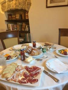 a table with plates of food on top at Villa La Cucullera in Catanzaro