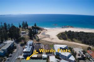 an aerial view of a beach with the words wonders flats at Wards Holiday Flat 3 in South West Rocks