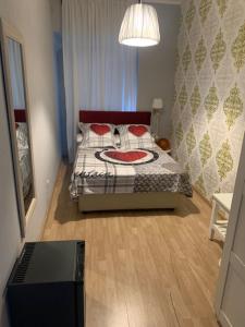 A bed or beds in a room at Sweet Home Faleria