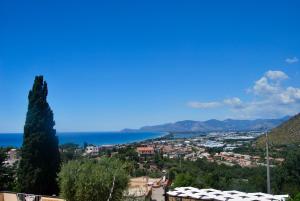 a view of a city and the ocean from a hill at Hotel Belvedere in Sperlonga