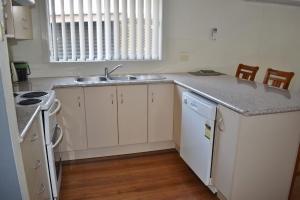 a kitchen with a sink and a counter top at Mariner 16 Flat 1 South West Rocks in South West Rocks