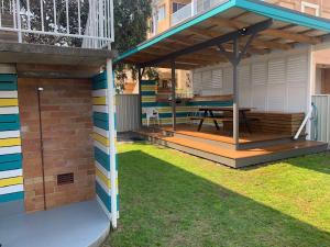 a deck with a picnic table under a pavilion at Mariner 16 Flat 1 South West Rocks in South West Rocks