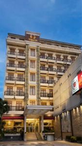 a large building with at Prima In Hotel Malioboro in Yogyakarta