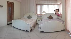 Postel nebo postele na pokoji v ubytování Slow Fly B&B