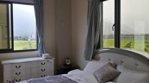Postel nebo postele na pokoji v ubytování Slow Fly B&B