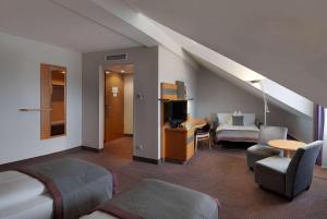 TV o dispositivi per l'intrattenimento presso Ramada by Wyndham Dresden