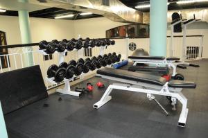 a gym with a rack of dumbbells at Luxury 2 bedroom apartment in Cape Town in Cape Town