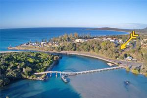 an aerial view of a bridge over a body of water at Nineteen On Gregory G02 in South West Rocks