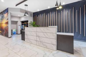 a lobby with a reception desk in a building at La Quinta Inn & Suites by Wyndham South Bend near Notre Dame in South Bend