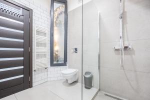 Koupelna v ubytování Central Park Apartments + 25 fotografií