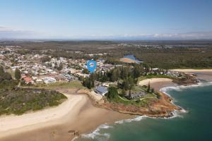 an aerial view of a resort on a beach at Traveller's Palms 7 - Bring your own linen. in South West Rocks