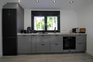 A kitchen or kitchenette at TESS Villa Le Clos Fleury