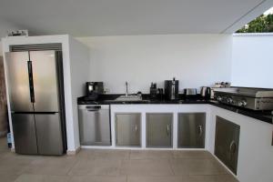 A kitchen or kitchenette at TESS Villa Le Clos Fleury