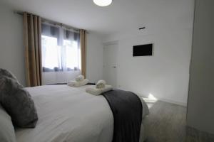 A bed or beds in a room at TESS Villa Le Clos Fleury