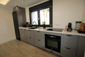 A kitchen or kitchenette at TESS Villa Le Clos Fleury