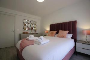 A bed or beds in a room at TESS Villa Le Clos Fleury