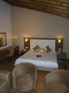 Postel nebo postele na pokoji v ubytování Livadia Hotel Kyperounta + 37 fotografií