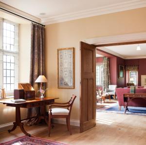 an open door into a living room with a desk at Ard na Sidhe Country House Hotel in Killorglin