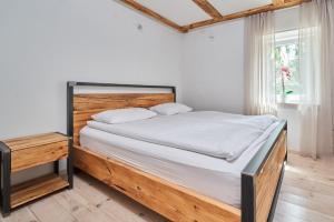 Posteľ alebo postele v izbe v ubytovaní Dobra Chata Jaśkowo