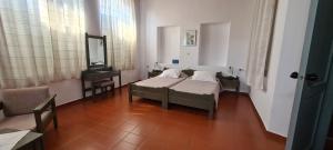 Postel nebo postele na pokoji v ubytování Vecchio Hotel