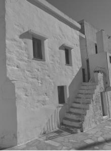 a stone building with stairs in front of it at stone house in Kathlikaros in Mési