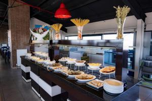 a buffet line with many plates of food on at AYDINBEY PARK OTEL in Konya