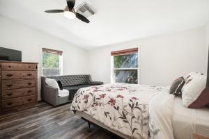 a bedroom with a bed and a ceiling fan at Spanish Valley Vinyard in Moab
