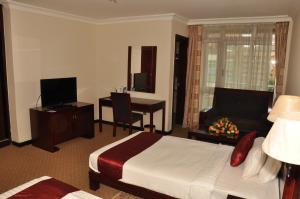 Ένα ή περισσότερα κρεβάτια σε δωμάτιο στο Kaleb Hotel
