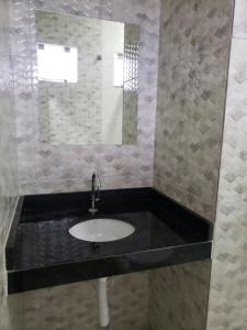 Ένα μπάνιο στο Estudio Recanto do Teimoso