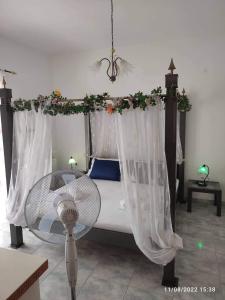A bed or beds in a room at Myrtia Guest House
