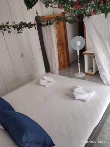 A bed or beds in a room at Myrtia Guest House