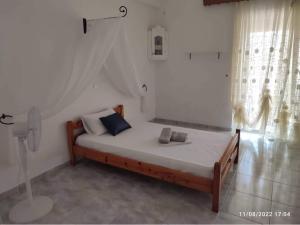 A bed or beds in a room at Myrtia Guest House