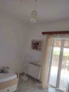 A bed or beds in a room at Myrtia Guest House