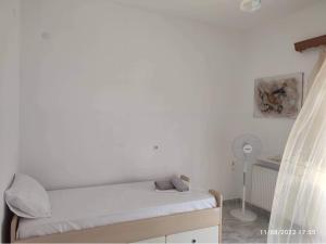 A bed or beds in a room at Myrtia Guest House