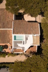 an overhead view of a white house with brown roofs at Vale Do Lobo Resort in Vale do Lobo