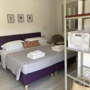 Llit o llits en una habitació de Oliveto Bed and Breakfast
