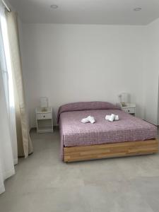 Postel nebo postele na pokoji v ubytování B&B S'arciaredda