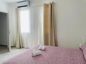 Postel nebo postele na pokoji v ubytování B&B S'arciaredda