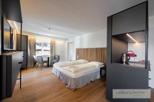 Voodi või voodid majutusasutuse Appartements zur Sonne toas