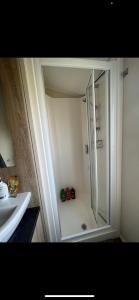 a bathroom with a shower and a sink at Yogi's Space in Birchington