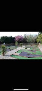 a picture of a garden with trees and plants at Yogi's Space in Birchington