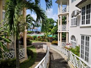 a bridge in front of a building at Stunning views at sky castles Ocho Rios in Eden Bowers